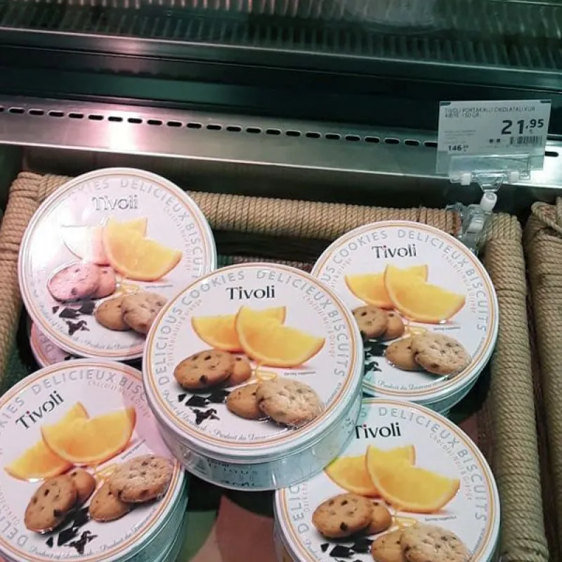Tivoli cookie tins with orange and chocolate cookies on a shelf in Turkey