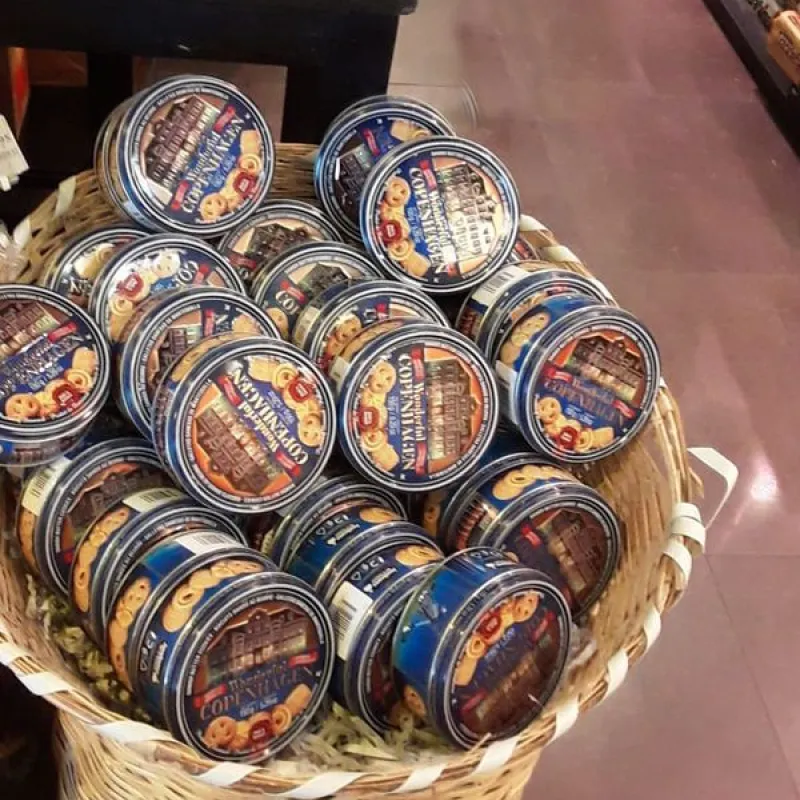 Basket of blue Danish butter cookie tins in a store in Turkey
