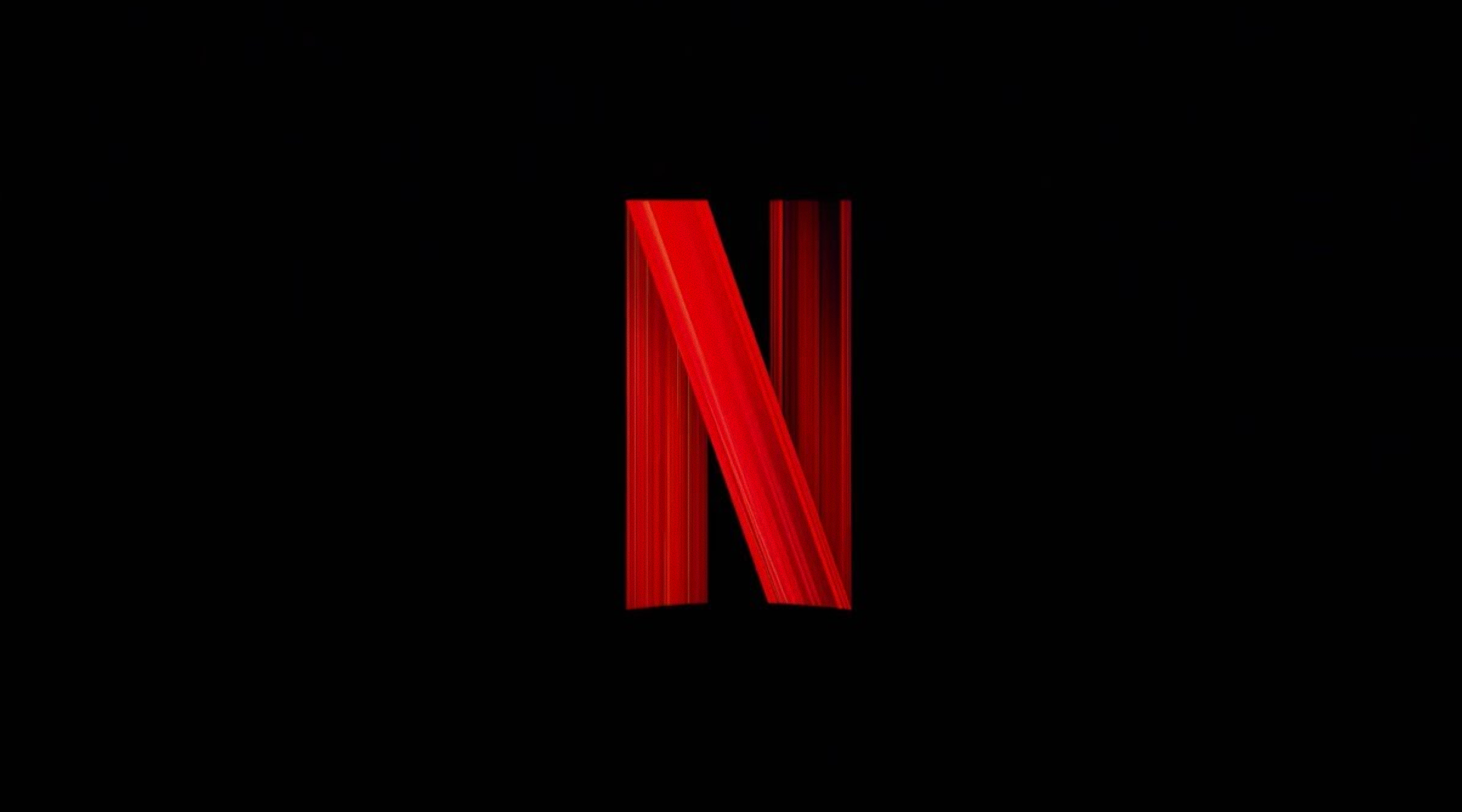 Logo Netflix sur fond noir, associé à l’animation d’ouverture et au son “Tudum”.