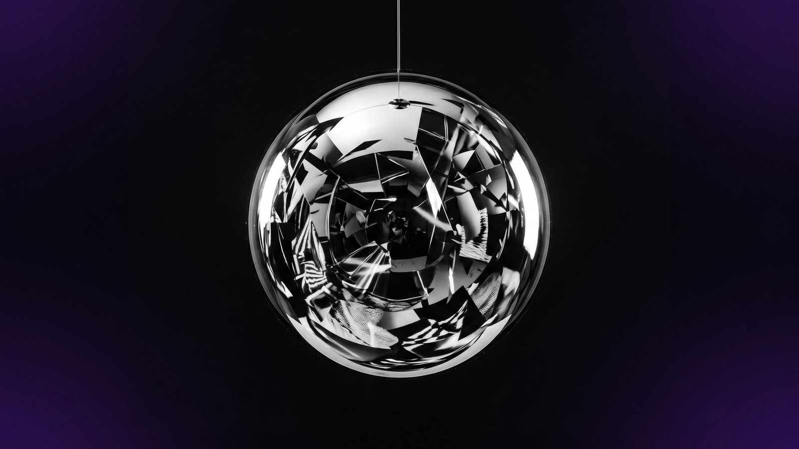 Polished mirror sphere reflecting fragmented light, symbolising brand reputation shaped by external perception
