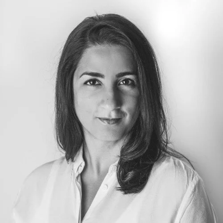 A person with long hair wearing a white shirtAI-generated content may be incorrect.