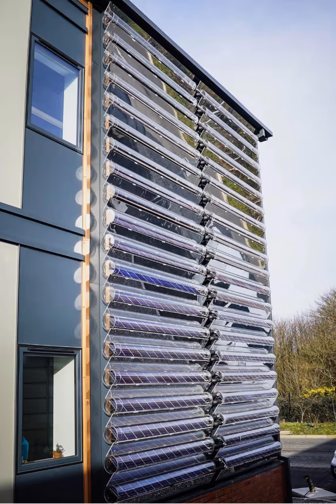 Solar PVT collectors on a facade building face.