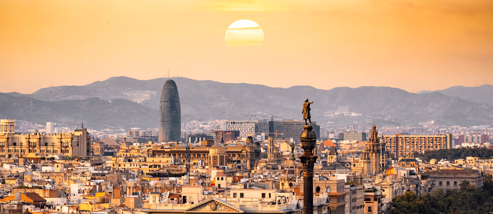 Rooftop view of Spanish city and sun setting