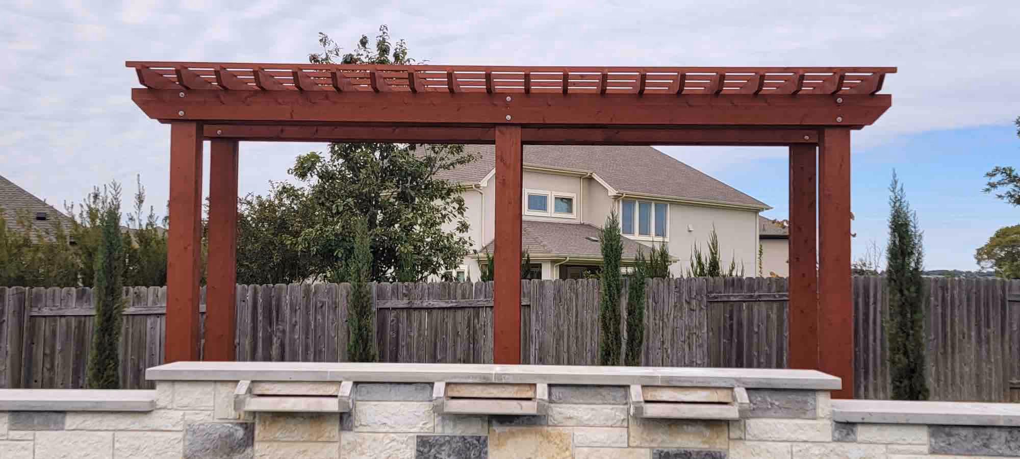 Add classic beauty and natural shade with a custom wood pergola.