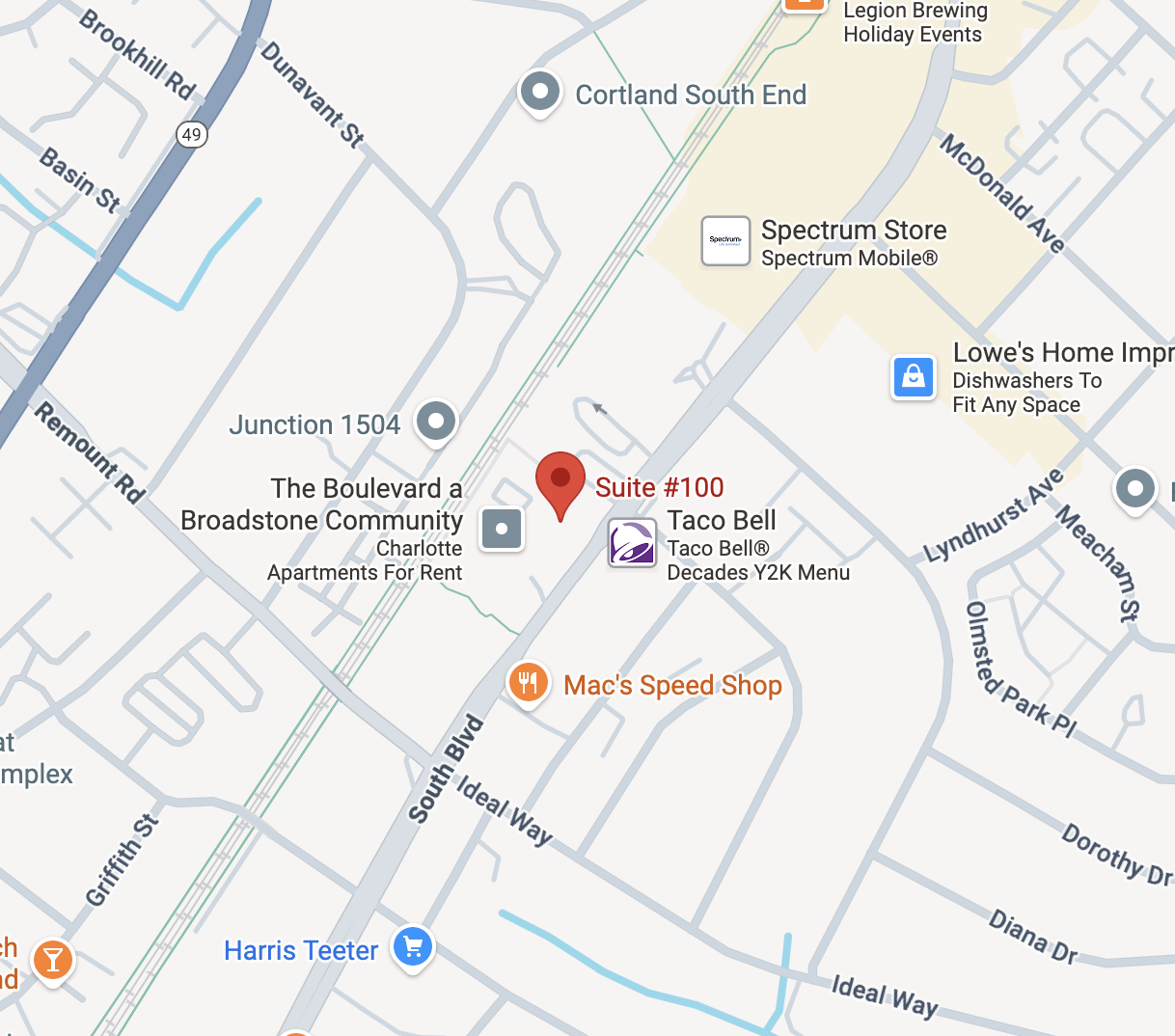 Map showing Suite #100 near Taco Bell and Mac's Speed Shop on South Blvd, with nearby landmarks including Broadstone Community apartments and Spectrum Store.