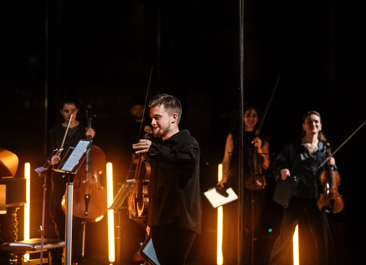 Dmitry Smirnov during the applause, after directing the Volta Collective in concert. Smiles all round.