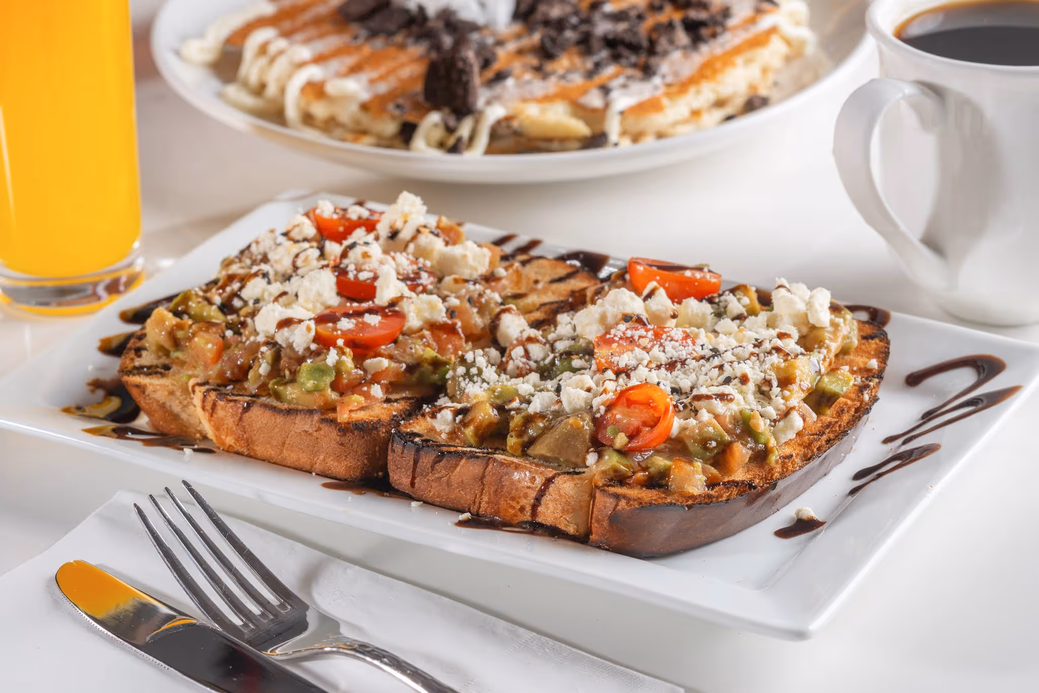 A plate of food with a fork and knife on it.