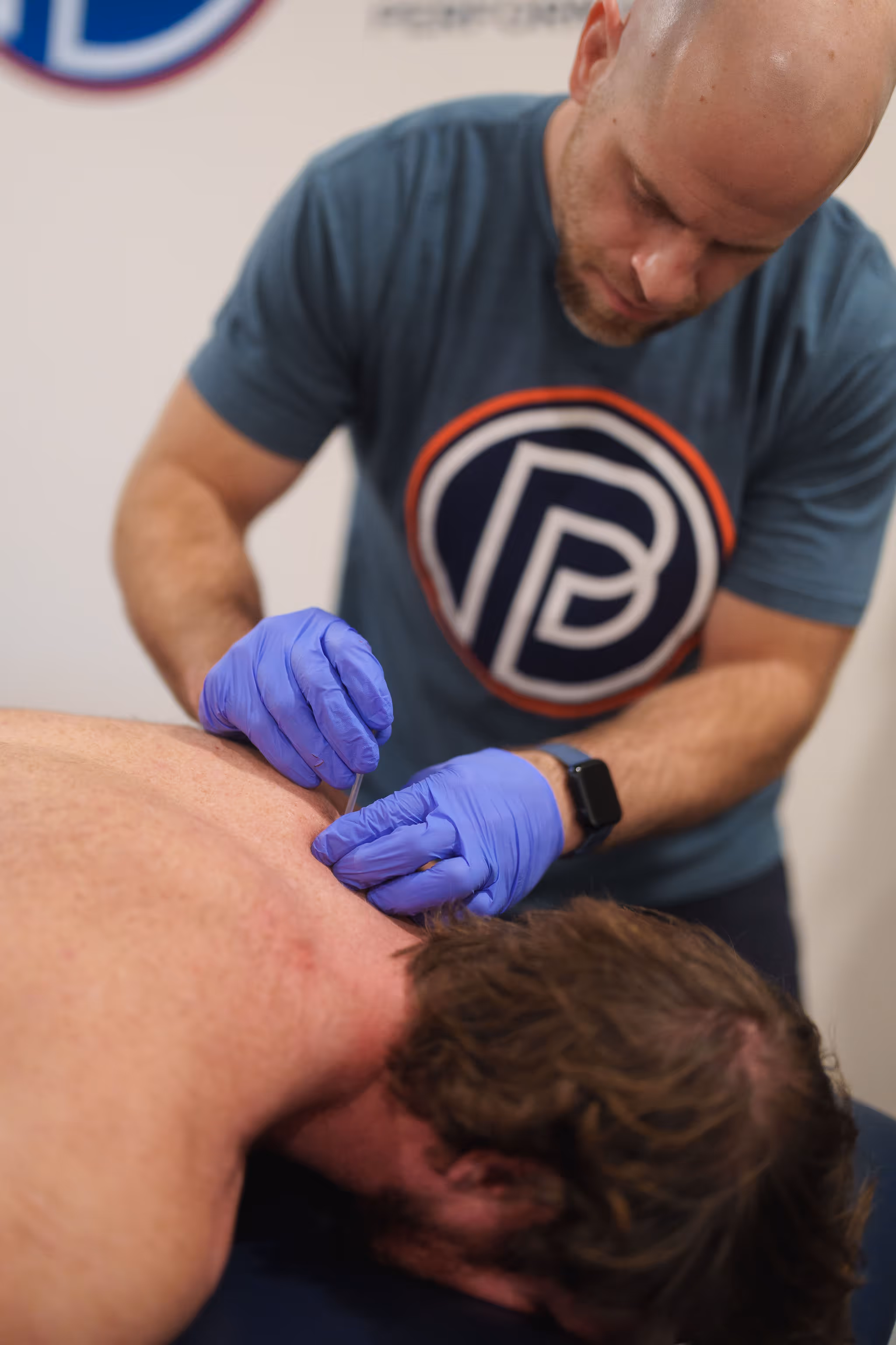 Board-certified physical therapist treating rotator cuff shoulder pain with manual therapy in Charlotte NC