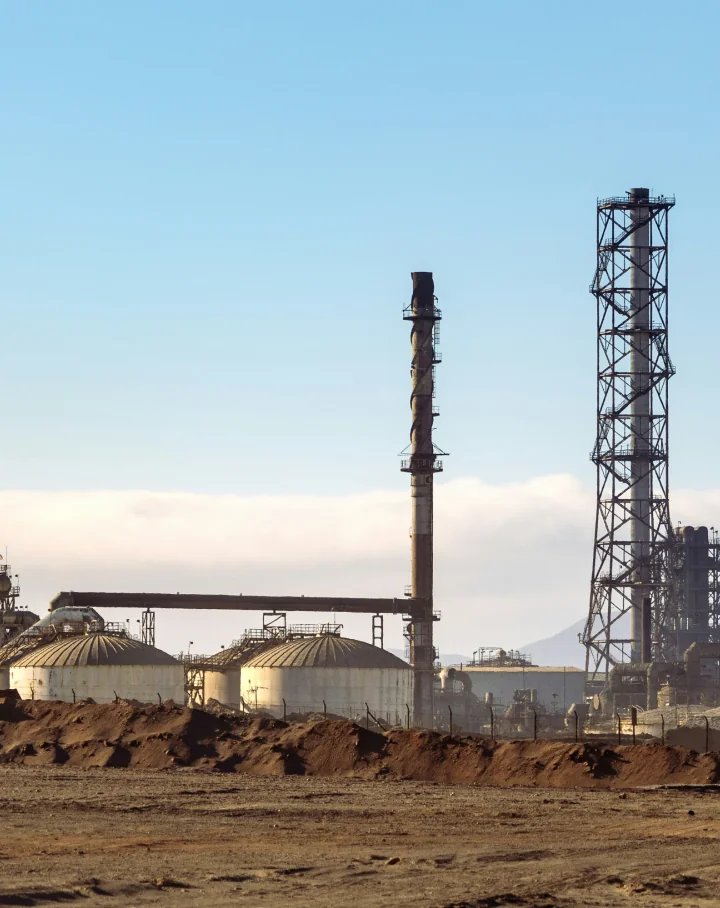 Industrial plant with storage tanks and flare stacks