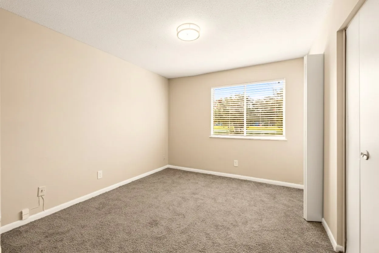 Spacious bedroom with natural light at Lakeside Lakeview