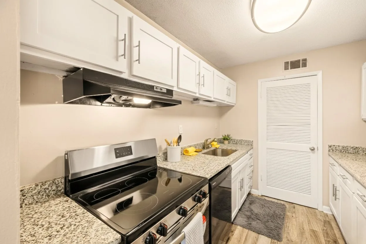 Kitchen with stainless stove and granite counters