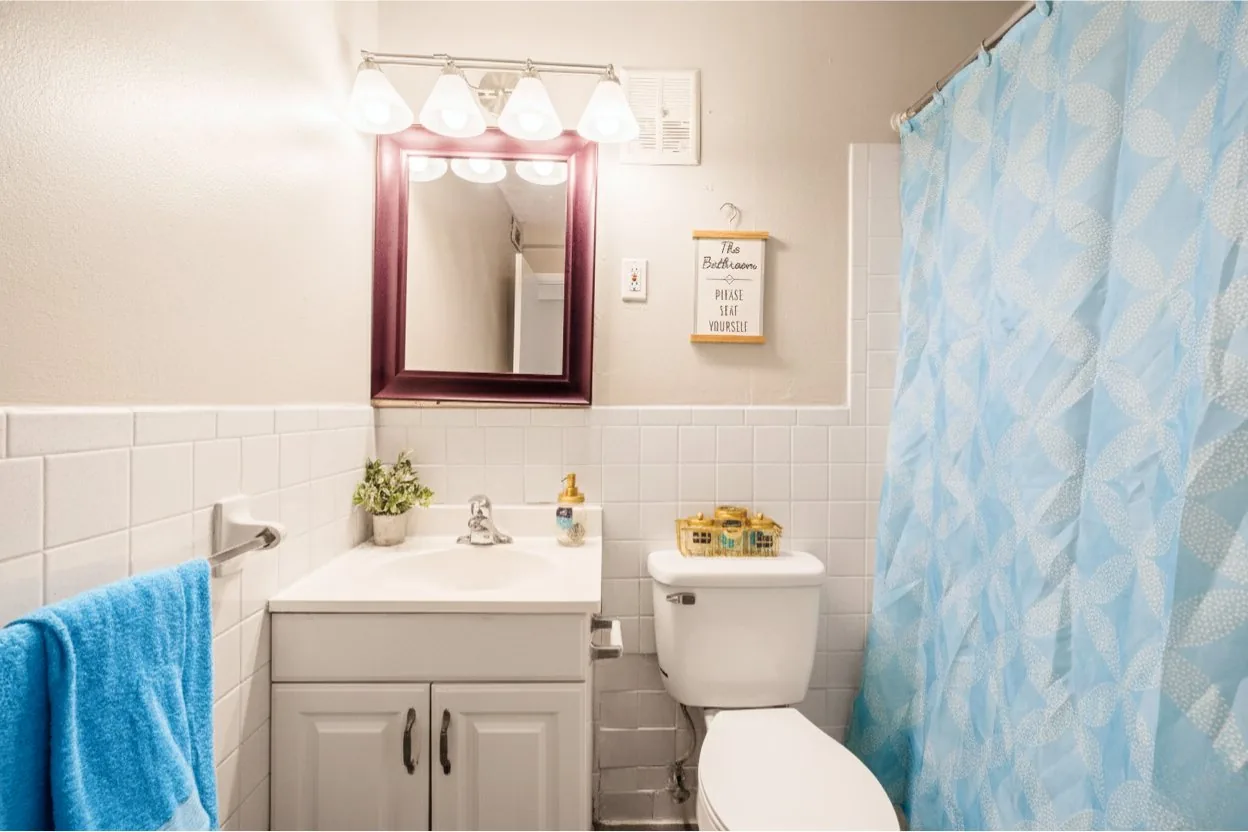 Bathroom with vanity and tile