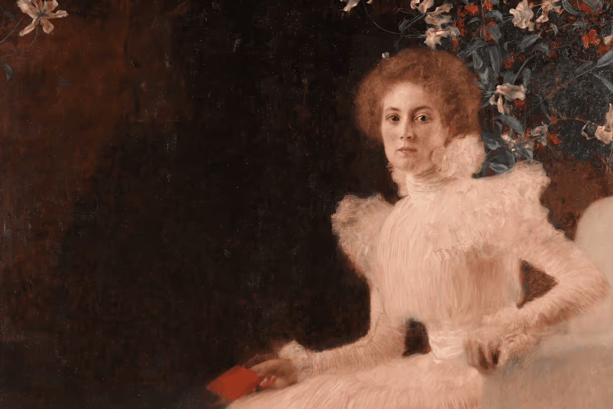 A dark, formal portrait painting, likely Klimt's "Portrait of Sonja Knips," showing a woman in a feathery white dress with a high ruffled collar, holding a small red object, set against a dark red-brown background with white flowers in the upper right.