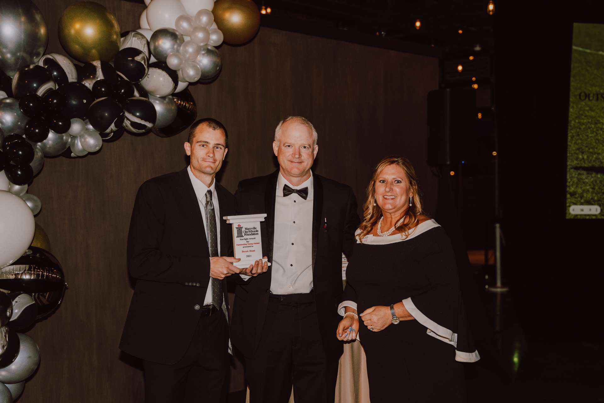 Derek Hunt, Class of 2007, being awarded Outstanding Young Alumni at the 2022 Starlight Gala.