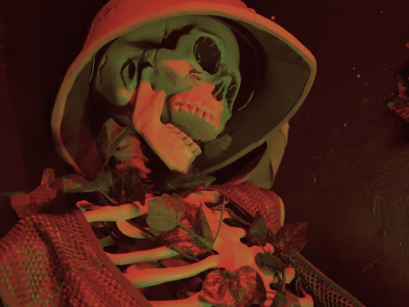 Skeleton wearing a hooded cloak with ivy leaves entwined around its ribcage under red and green lighting.