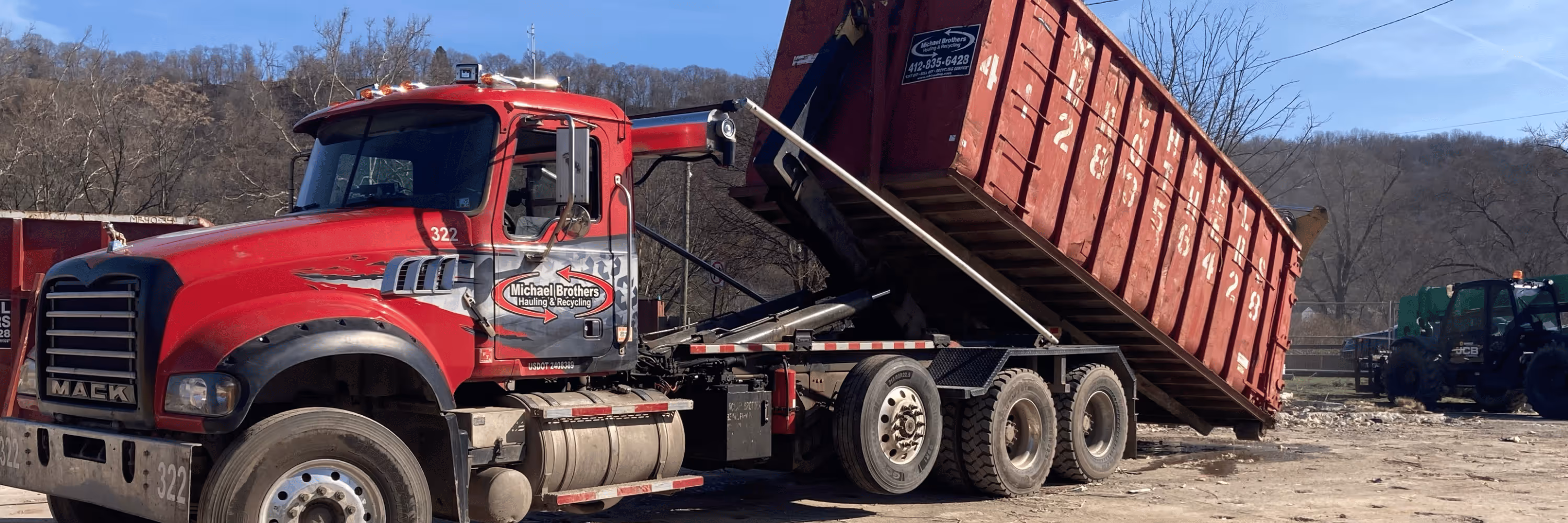 Dumpster Delivery Truck