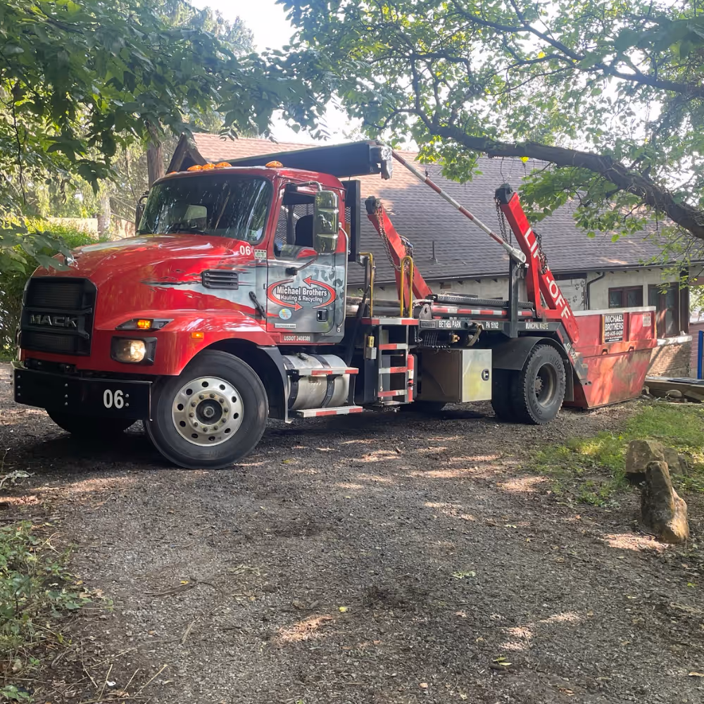 Truck with Lift Off Dumpster