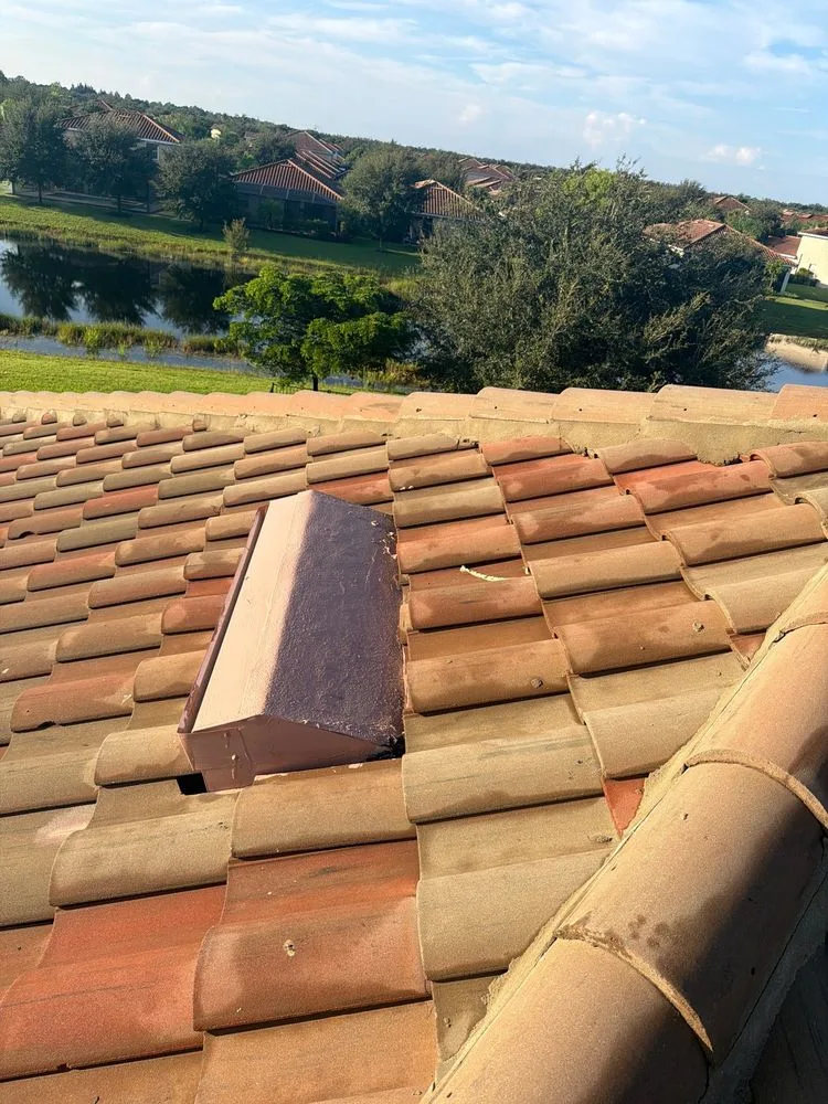 Finished tile roof in Naples with the new vent in place and the surrounding tile restored