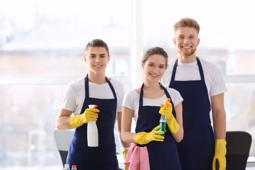 Smiling professional cleaning team ready to assist clients - EL ZOULOU Cleaning Services