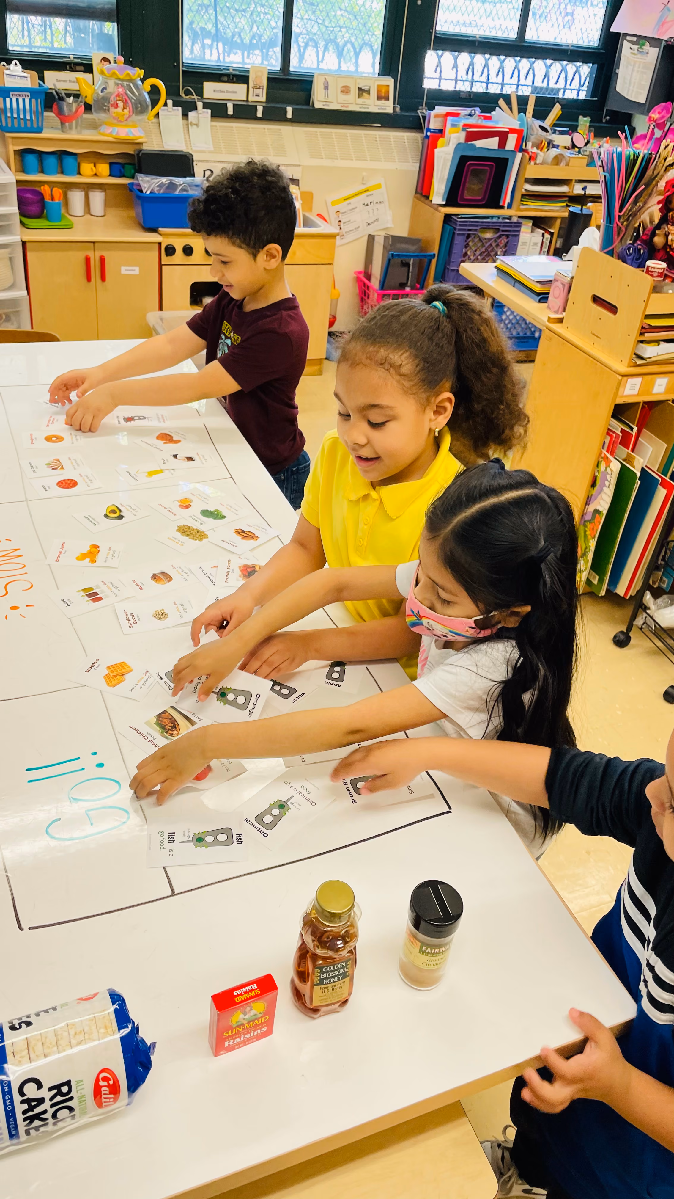 Students working together on classroom activity at table