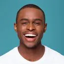 A close up of a person wearing a white shirt.