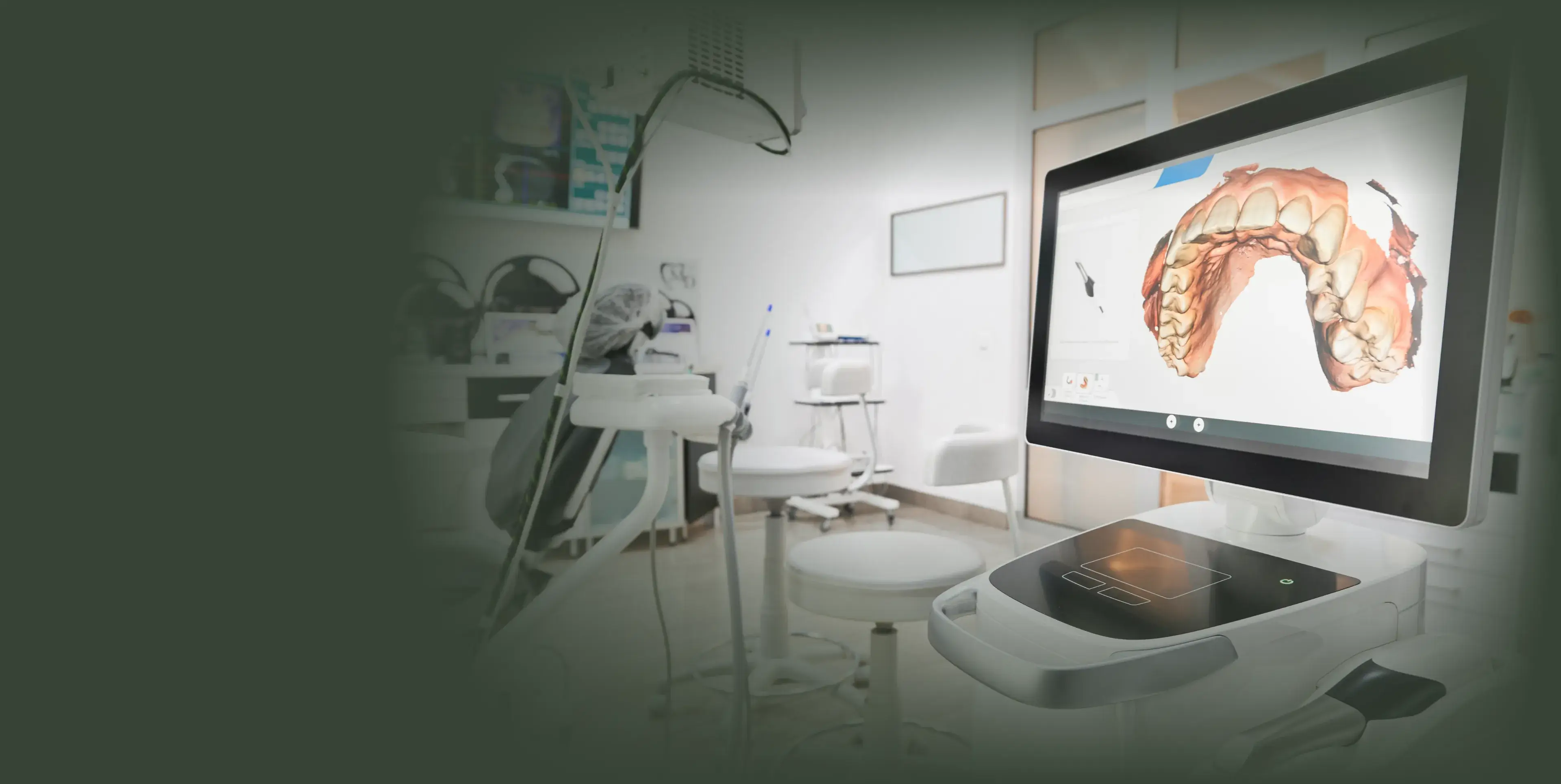A computer screen in a dental office displays a 3D model of a brain.