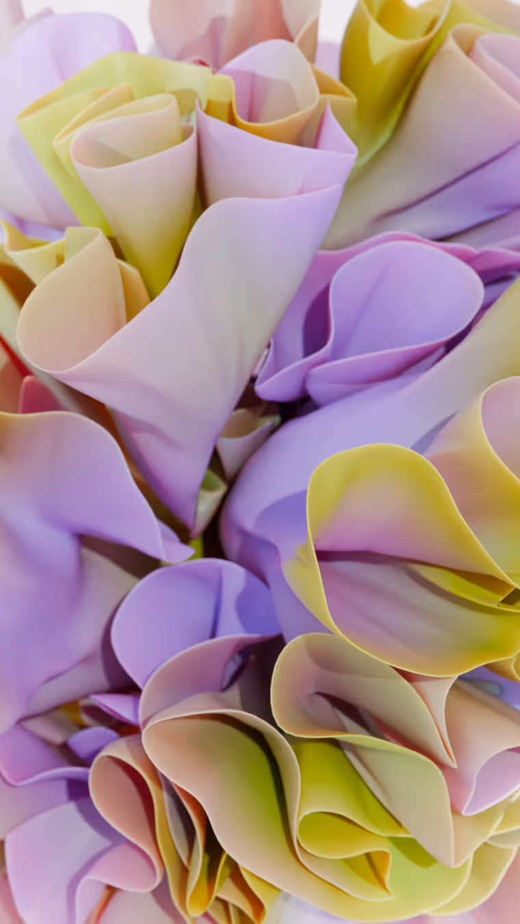 Close-up of abstract, softly curled shapes in pastel shades of purple, yellow, and pink.