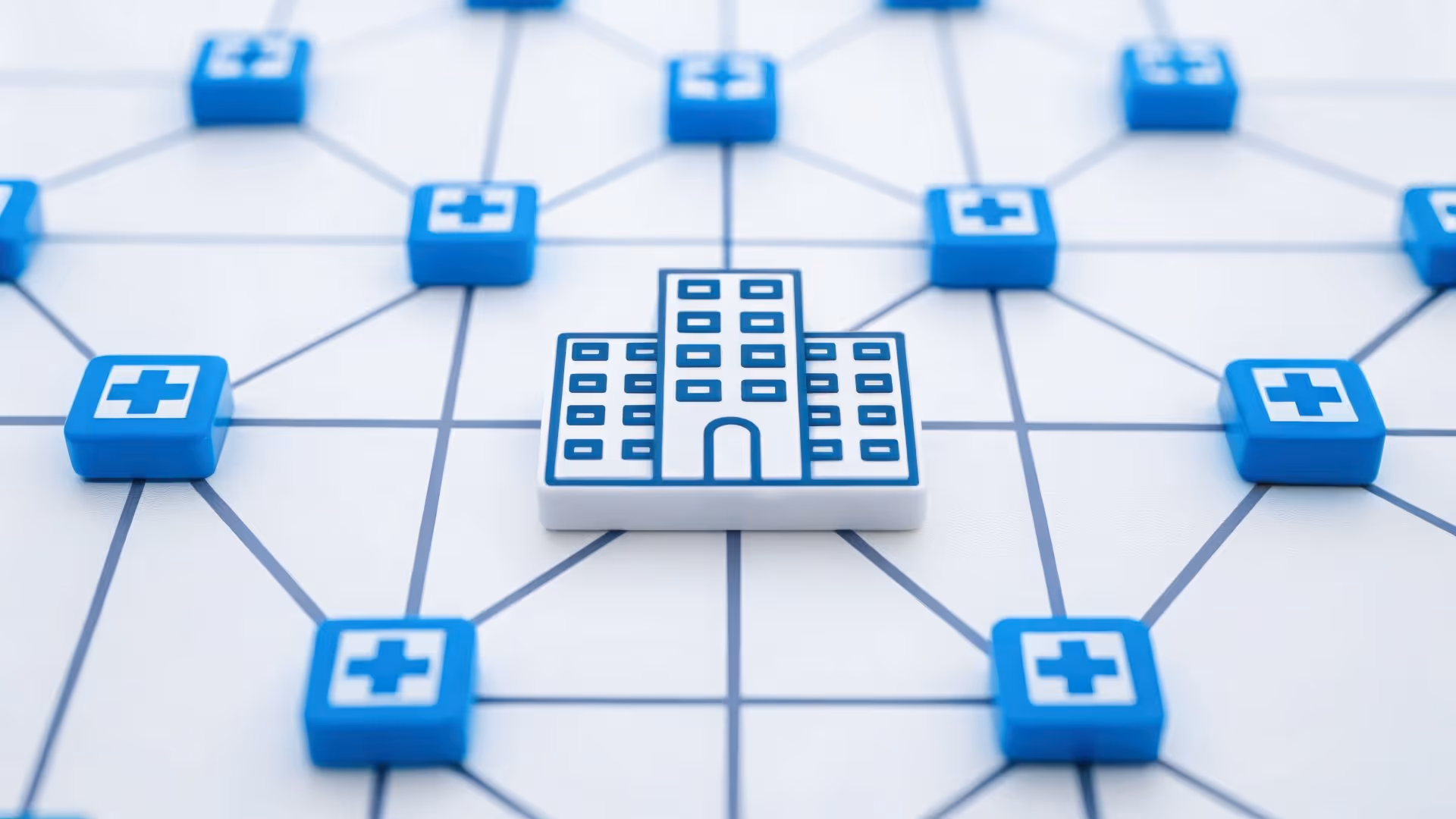 Central hospital icon connected by lines to multiple medical cross icons representing a healthcare network.