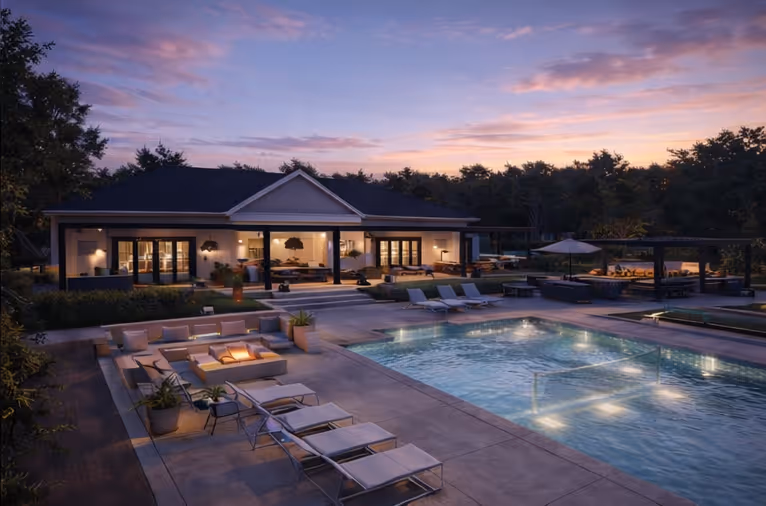 Poolside clubhouse patio at dusk with a fire pit and lounge seating
