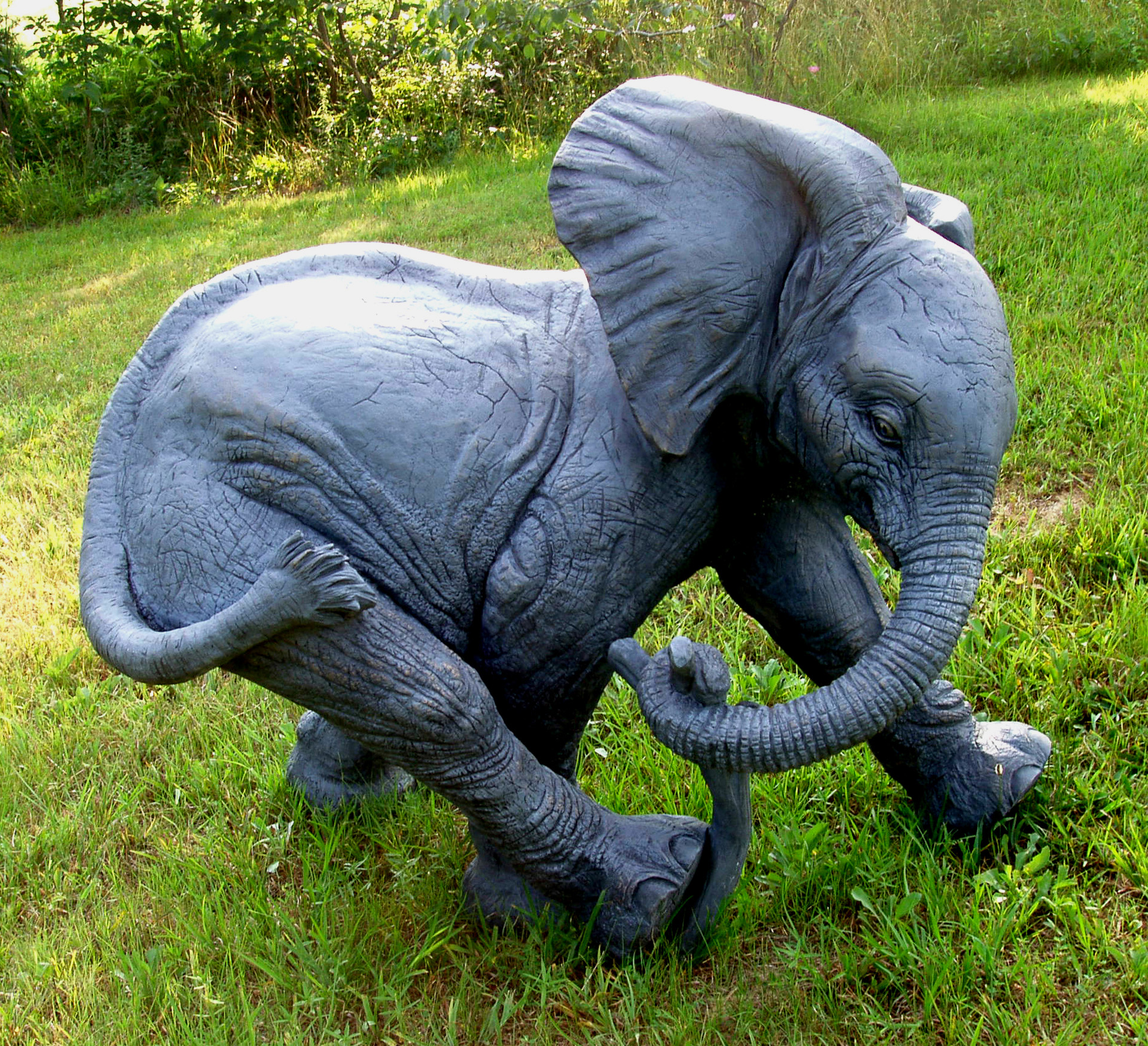 Ely Playing with a Stick (African Elephant) — public sculpture on the Waco Sculpture Zoo trail