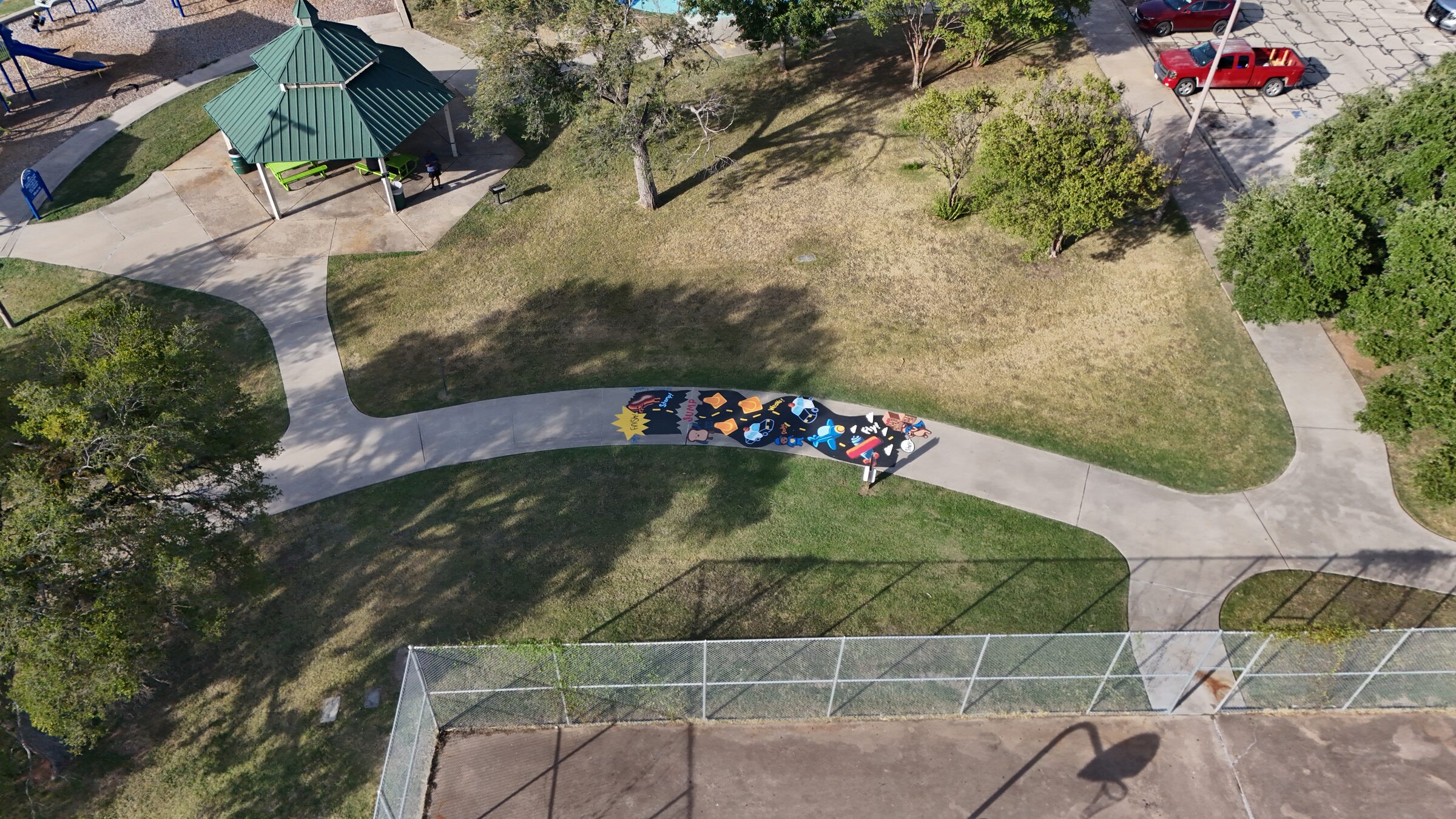 Aerial view of a Dogman-themed sidewalk obstacle course at Kendrick Park.