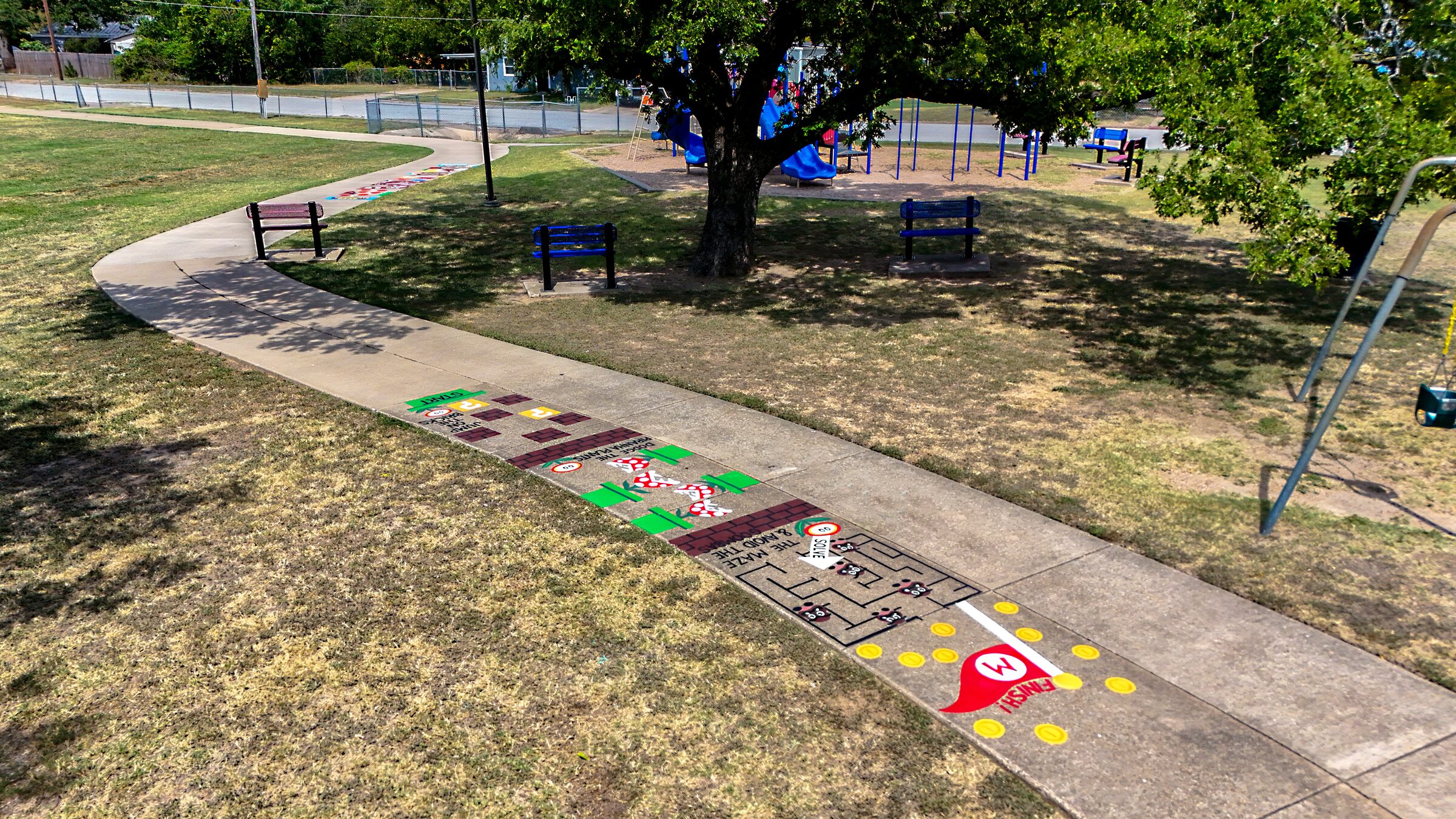 Aerial view of a Mario-themed sidewalk obstacle course at Veterans Memorial Park.