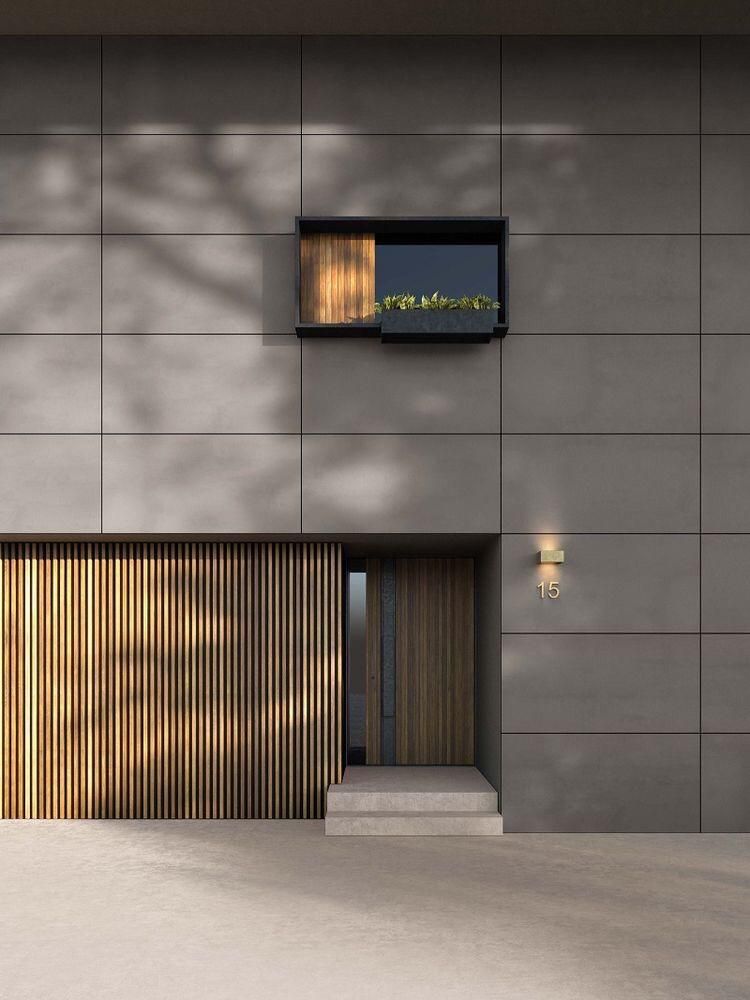 Estrutura modular branca com amplas janelas de vidro escuras em um espaço aberto.