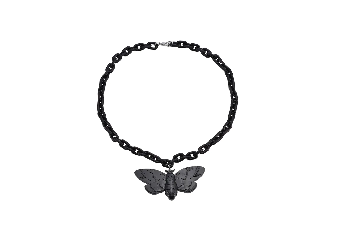 A butterfly necklace made out of black resin