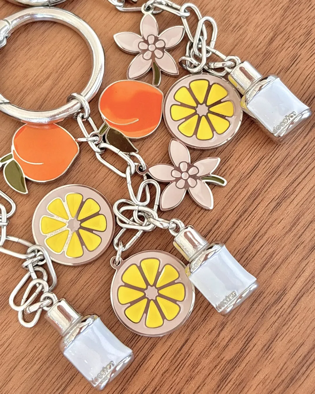 A custom bag charm with 4 enamel colored pendants 