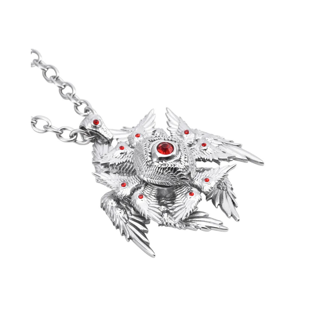 A stainless steel pendant with multiple red gems