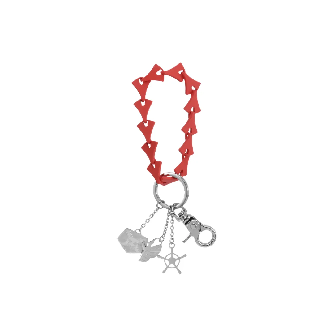 A red charm bracelet with silver hanging charms
