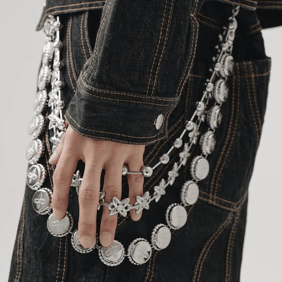 Three wallet chains stacked together in a lifestyle shot