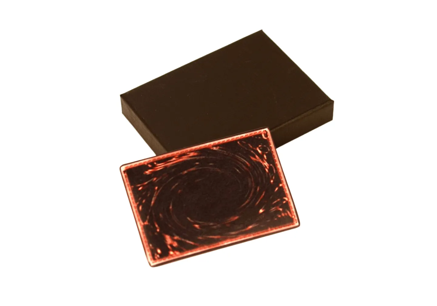 Three different leather cardholders with debossed pattern and metal emblem