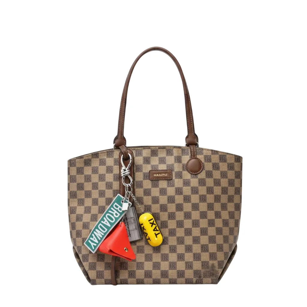 HM bag charm on a brown leather bag 