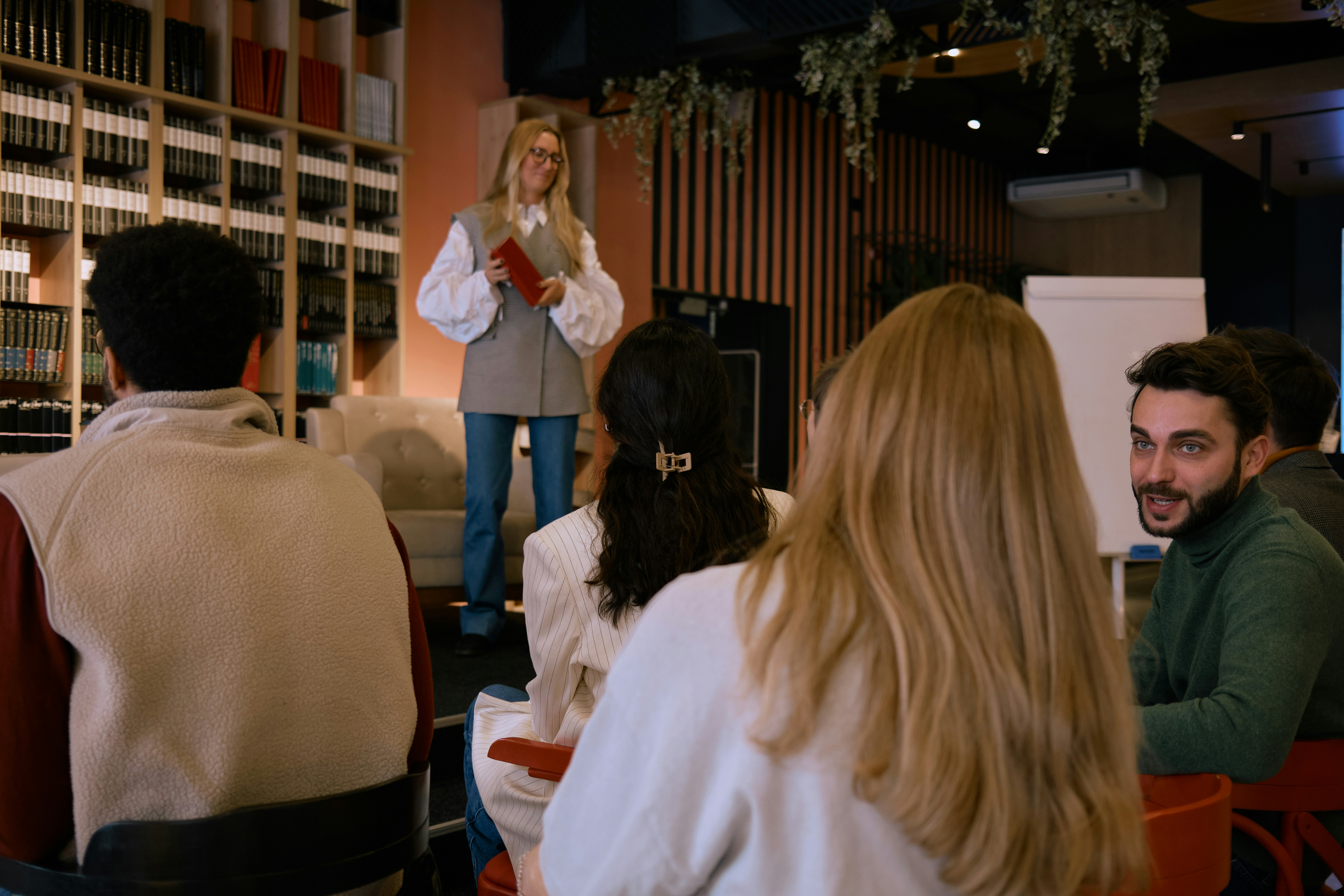 A marketing leader speaks with team about creative campaign