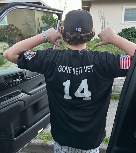 Little league jersey with "Gone West Vet" on the back