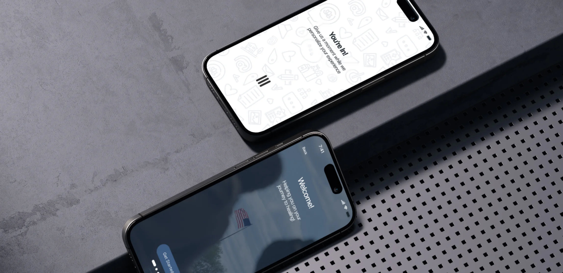 Two phones showing Enlace screens on a dark textured surface
