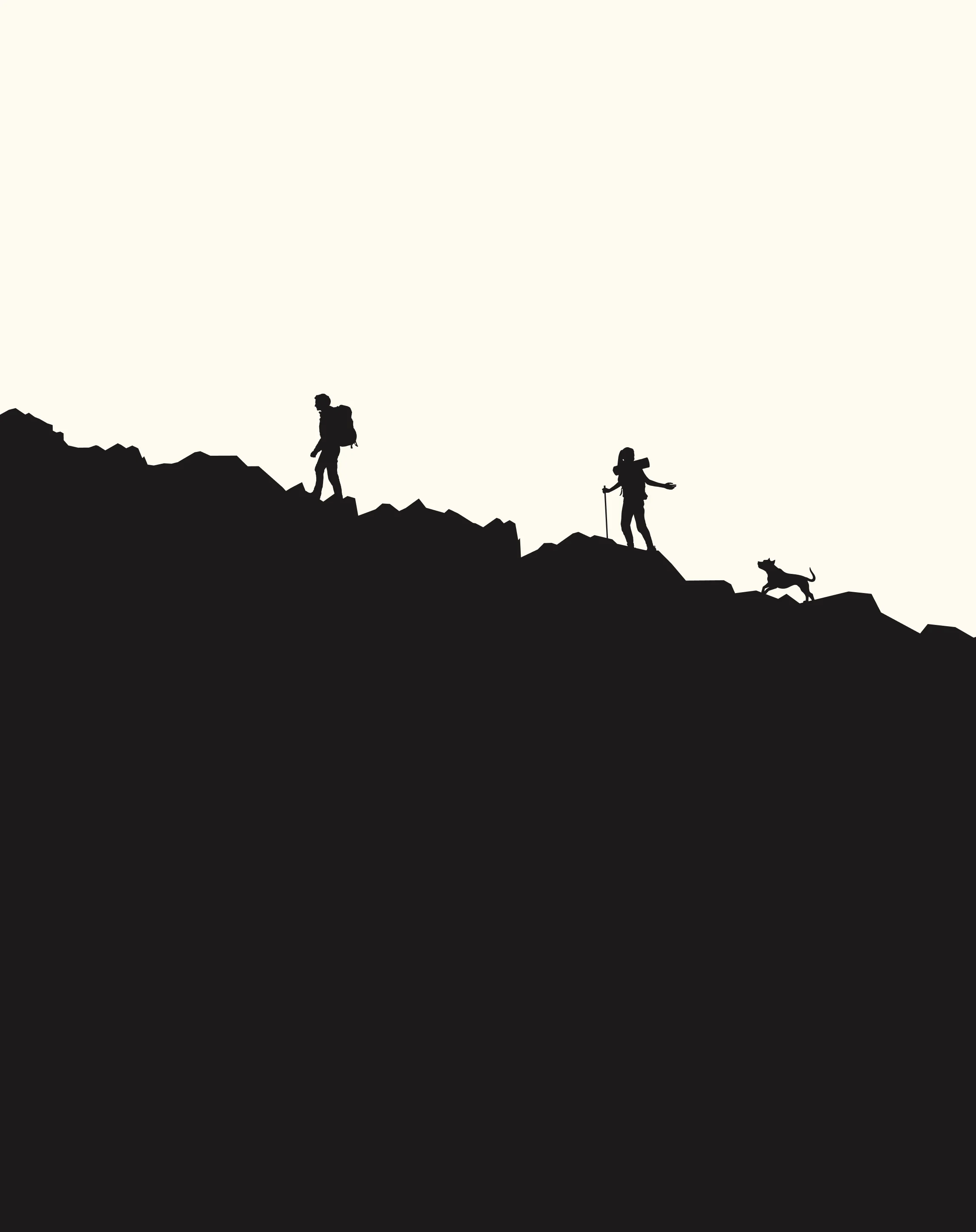 Silhouette of two hikers and a dog walking along a mountain ridge