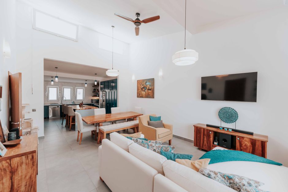 Stylish open-concept living area with modern design and furniture.