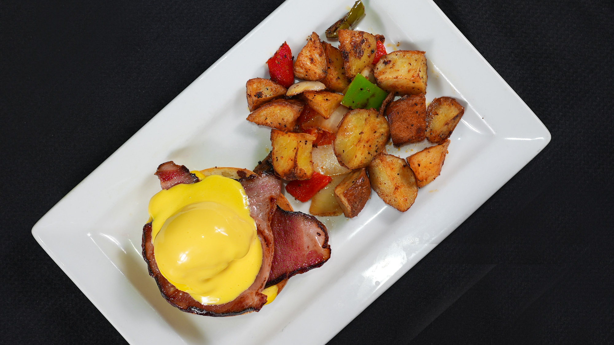 A half portion of our classic benedict. Served with house potatoes