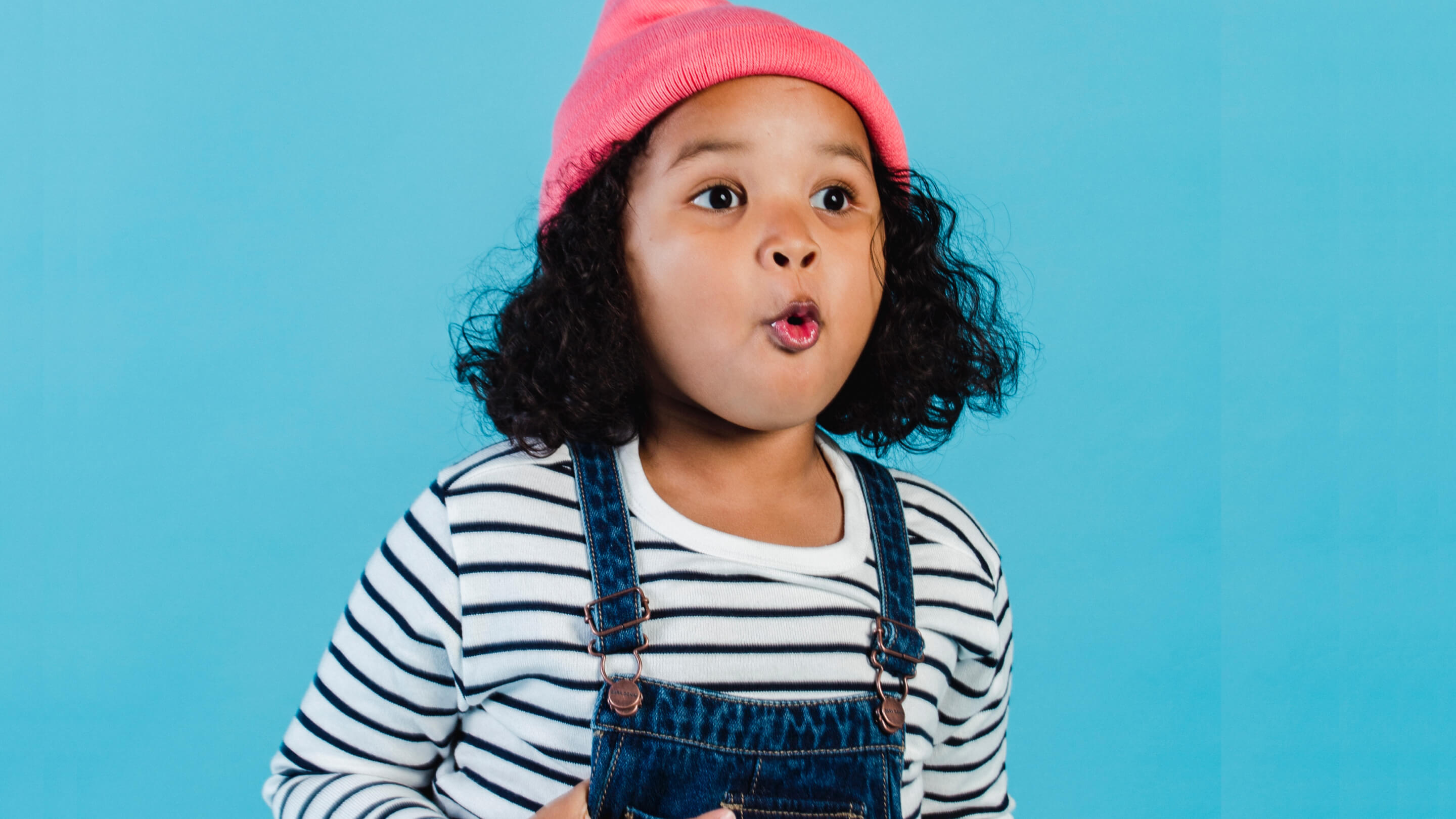 Curious young girl captivated in a moment of wonder.