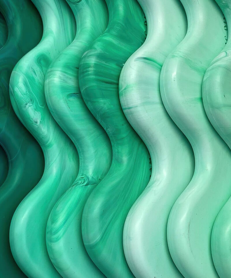 Pile of recycled plastic coat hangers.