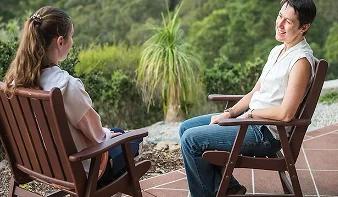 cath talking with client and smiling 