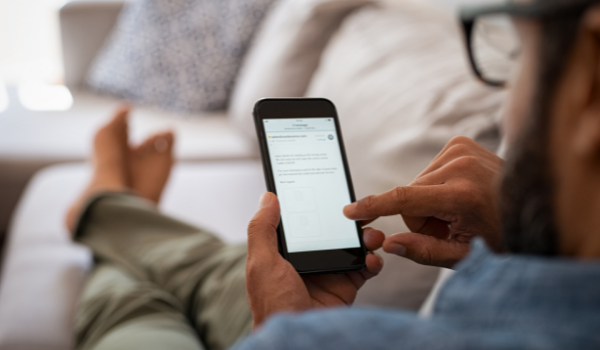 A guest reading an email from the tour operator
